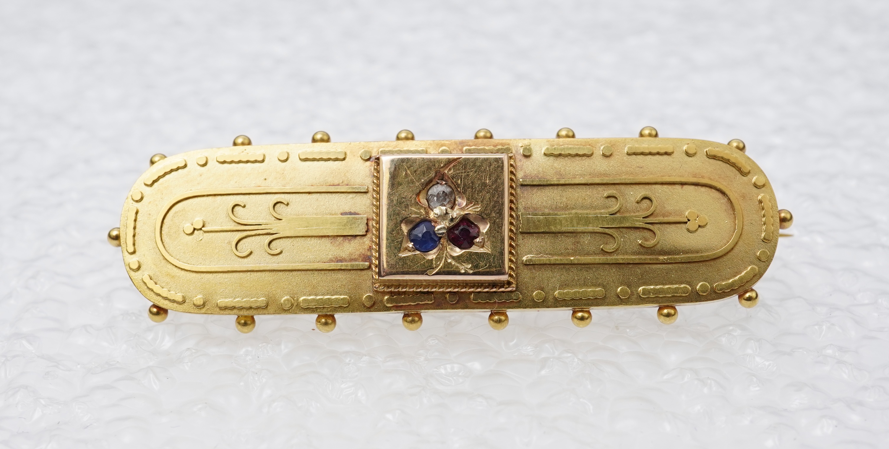 A Victorian gold, gem-set and diamond brooch, circa 1889